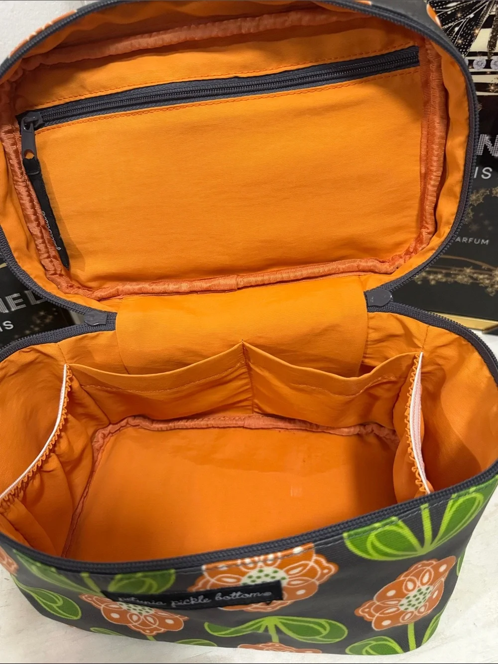 Petunia Pickle Bottom Gray Cosmetic Case with Orange Floral & Green Leaves
