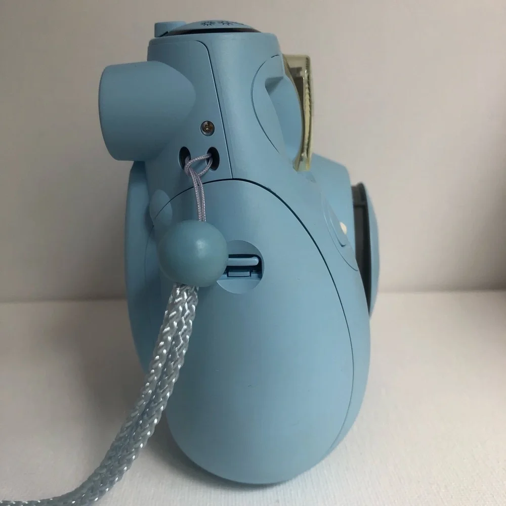 Blue instax mini 7s Polaroid camera