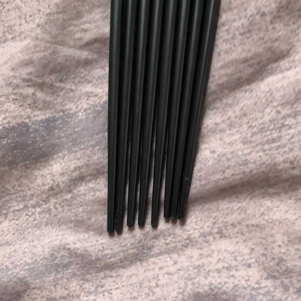 Set of 8 chopsticks, never used.