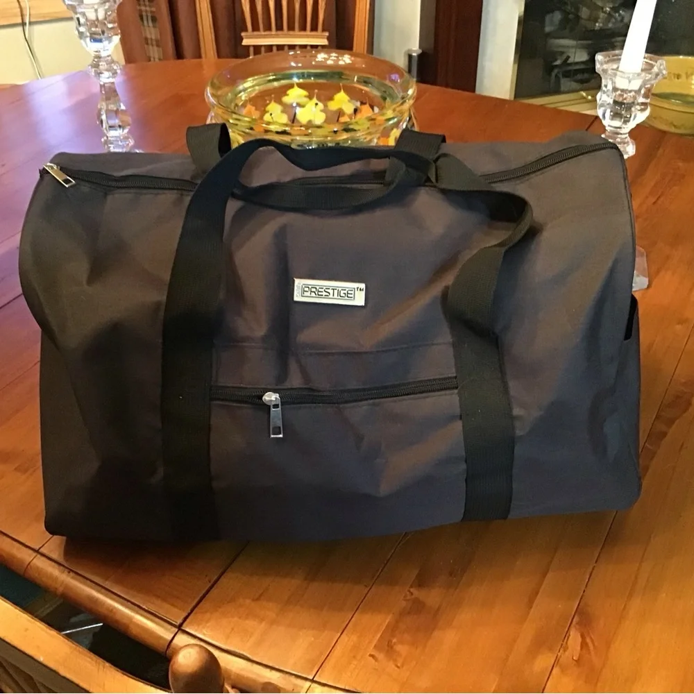 NWOT Prestige Travel Duffle Bag in Black.