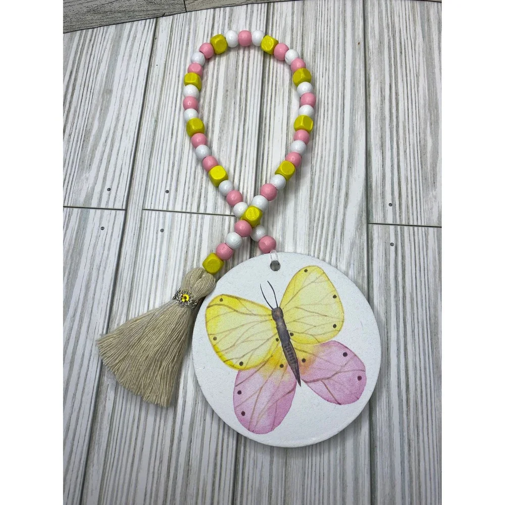 Wooden bead garland with butterfly print in spring tones /wooden spring garlands