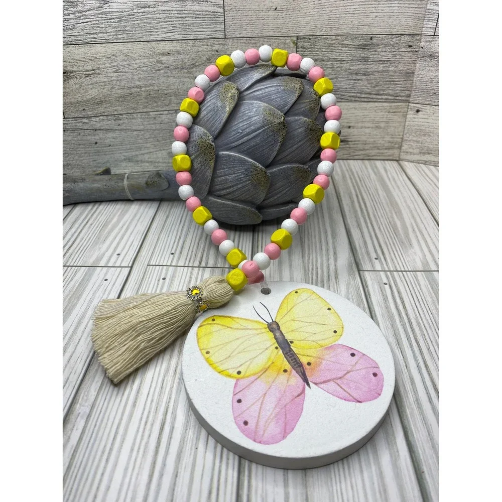 Wooden bead garland with butterfly print in spring tones /wooden spring garlands