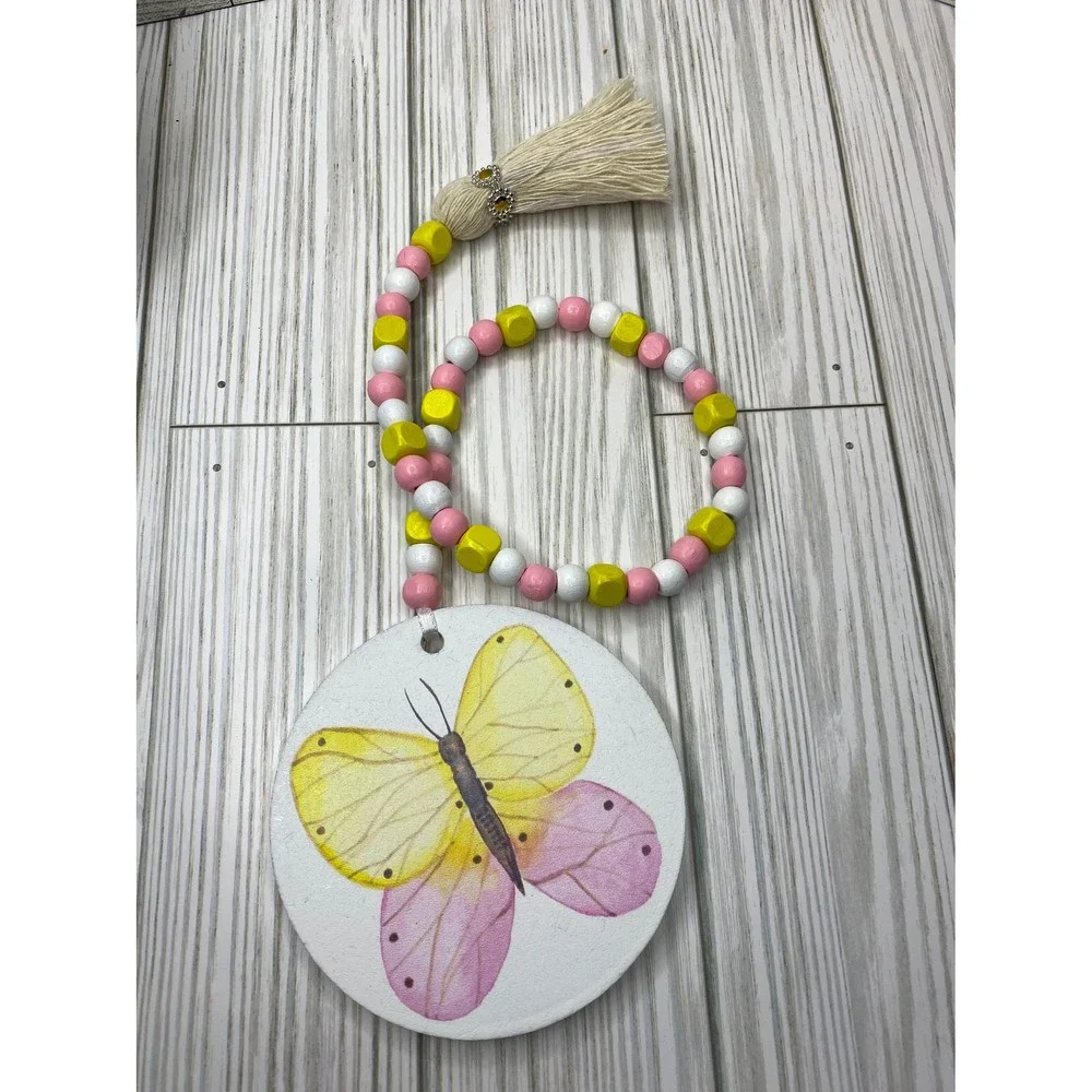 Wooden bead garland with butterfly print in spring tones /wooden spring garlands