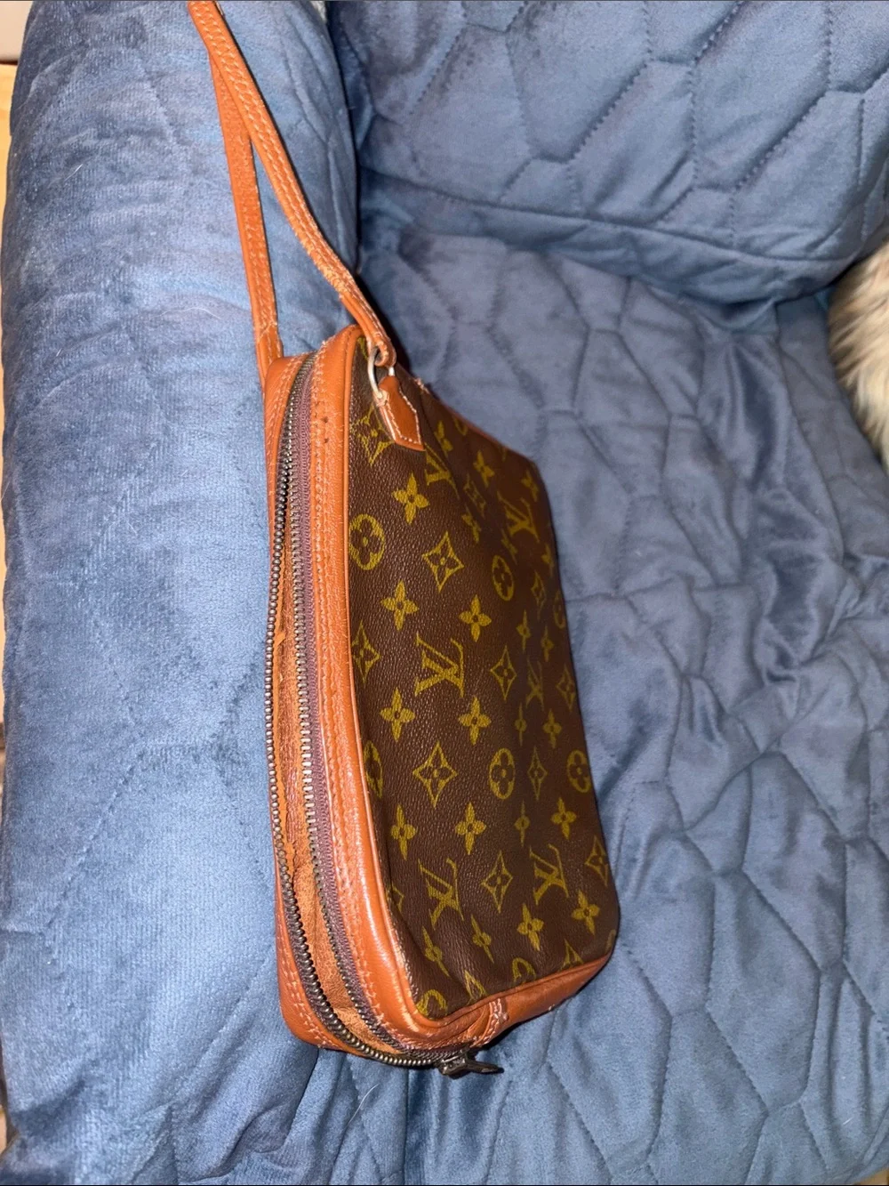Louis Vuitton Brown Leather Monogram cosmetic case with wristlet strap.