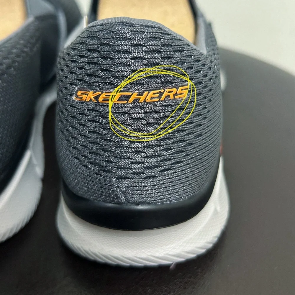 Skechers “charcoal name chipping