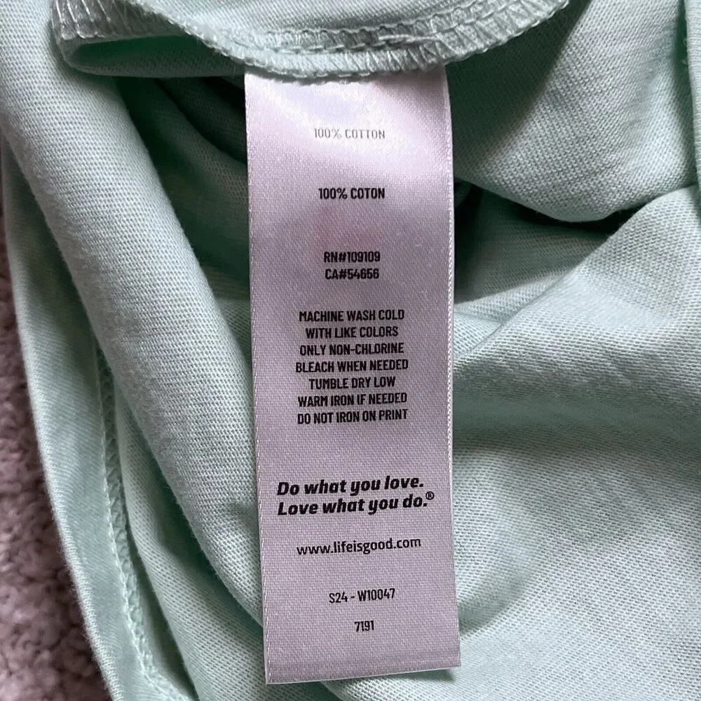 NWT LIFE IS GOOD Beach T-shirt Women’s Small Ocean Lake Sun I Like It Here Green