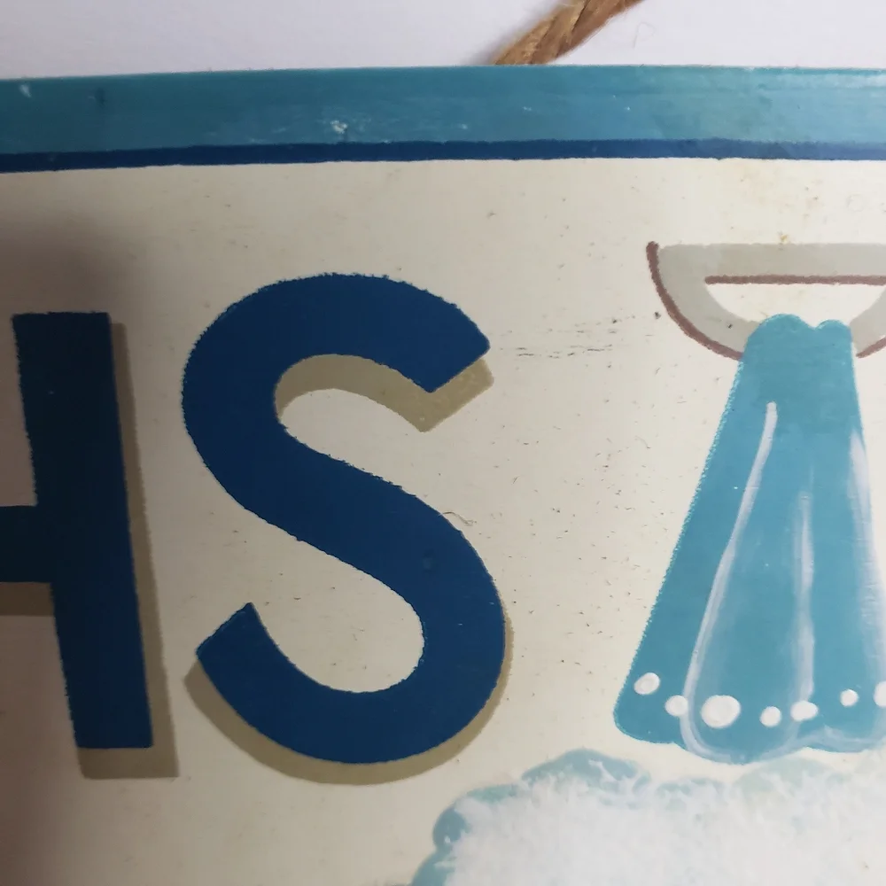 Decorative sign for a bathroom. 221