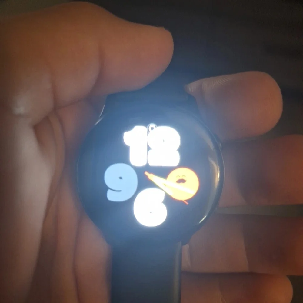 Samsung Black Smartwatch with Round Display and Digital Interface