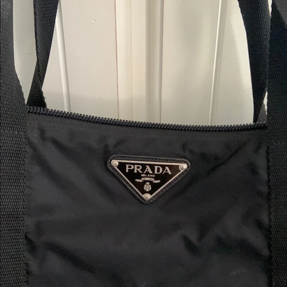 Prada Black Duffel Bag with Sleek Design and Versatile Use