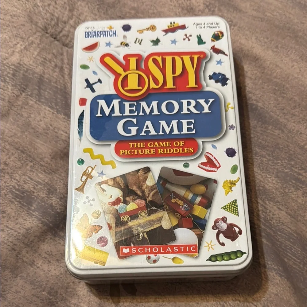 Scholastic brand I Spy Memory Game Tin. New in box. The game of picture riddles!