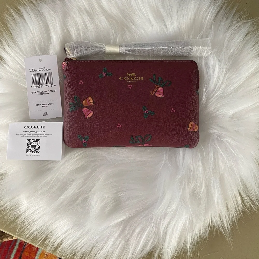 Coach NWT corner zip wristlet with holiday bells print