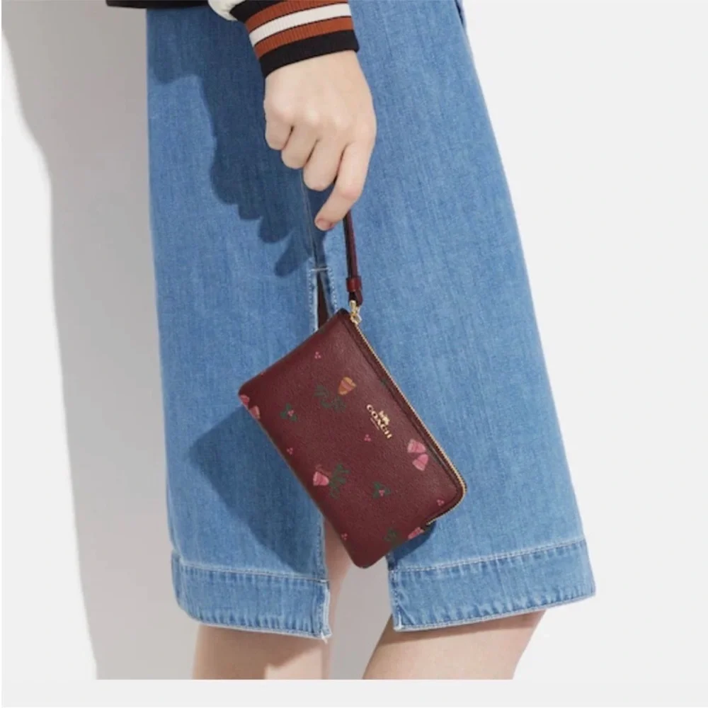 Coach NWT corner zip wristlet with holiday bells print