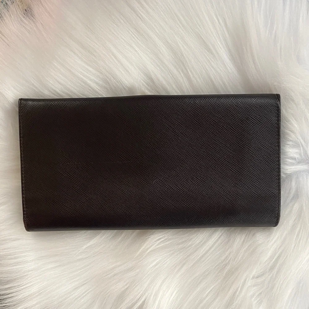 Salvatore Ferragamo Deep brown leather wallet with gold accent
