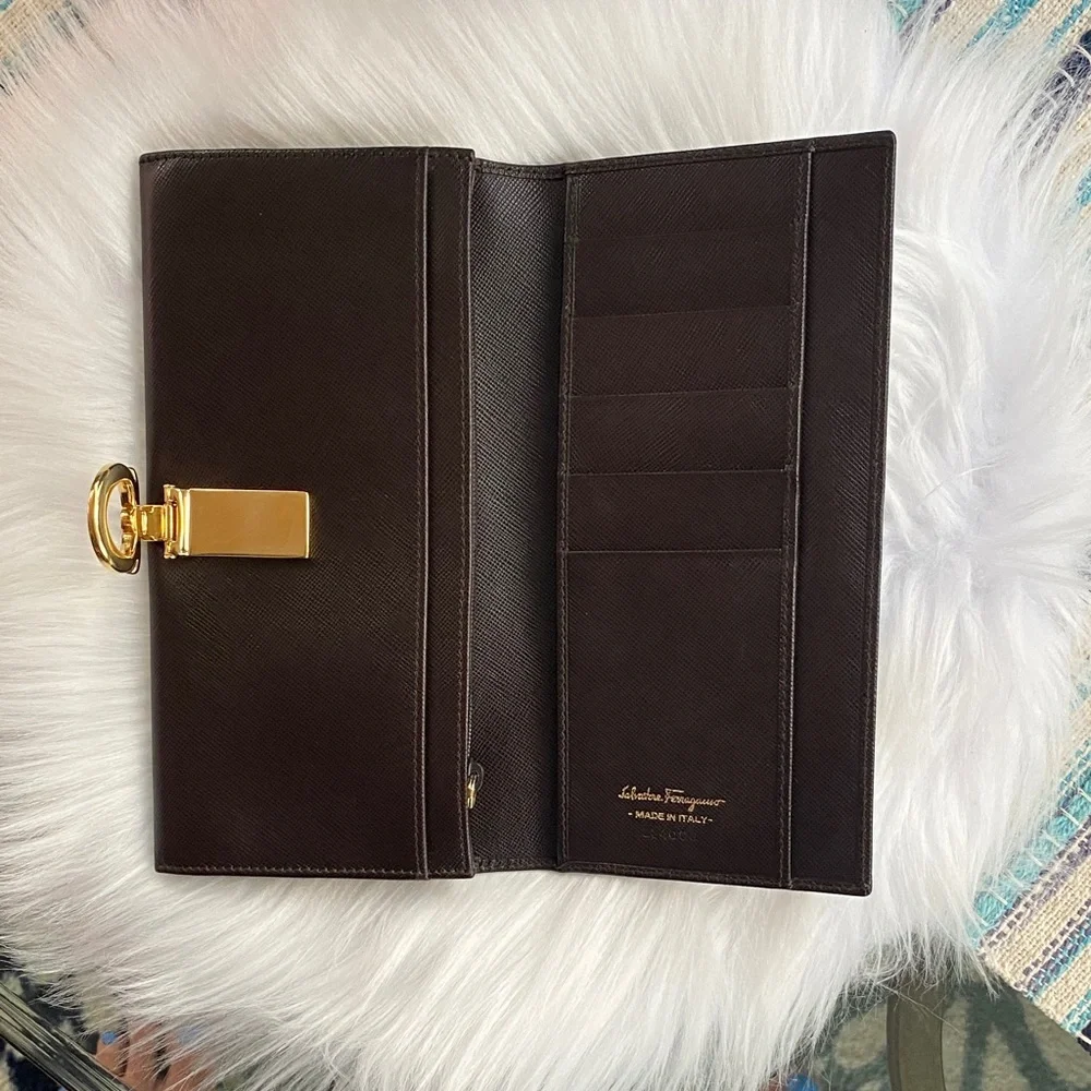 Salvatore Ferragamo Deep brown leather wallet with gold accent