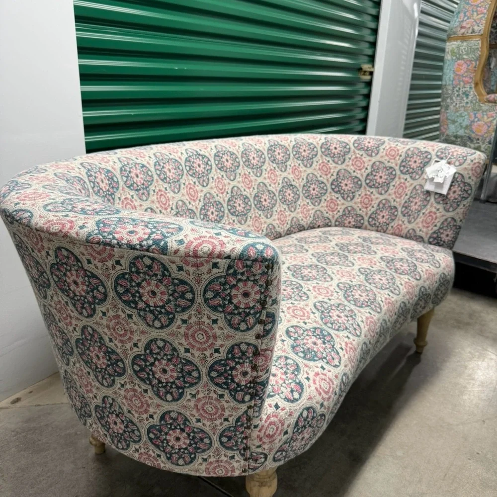 Elegant Patterned Sofa with Pink and Blue Accents