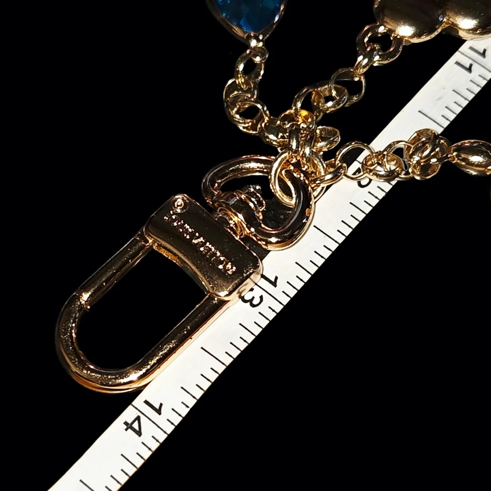 Elegant Gold Bag Chain/Charm with Blue Accent