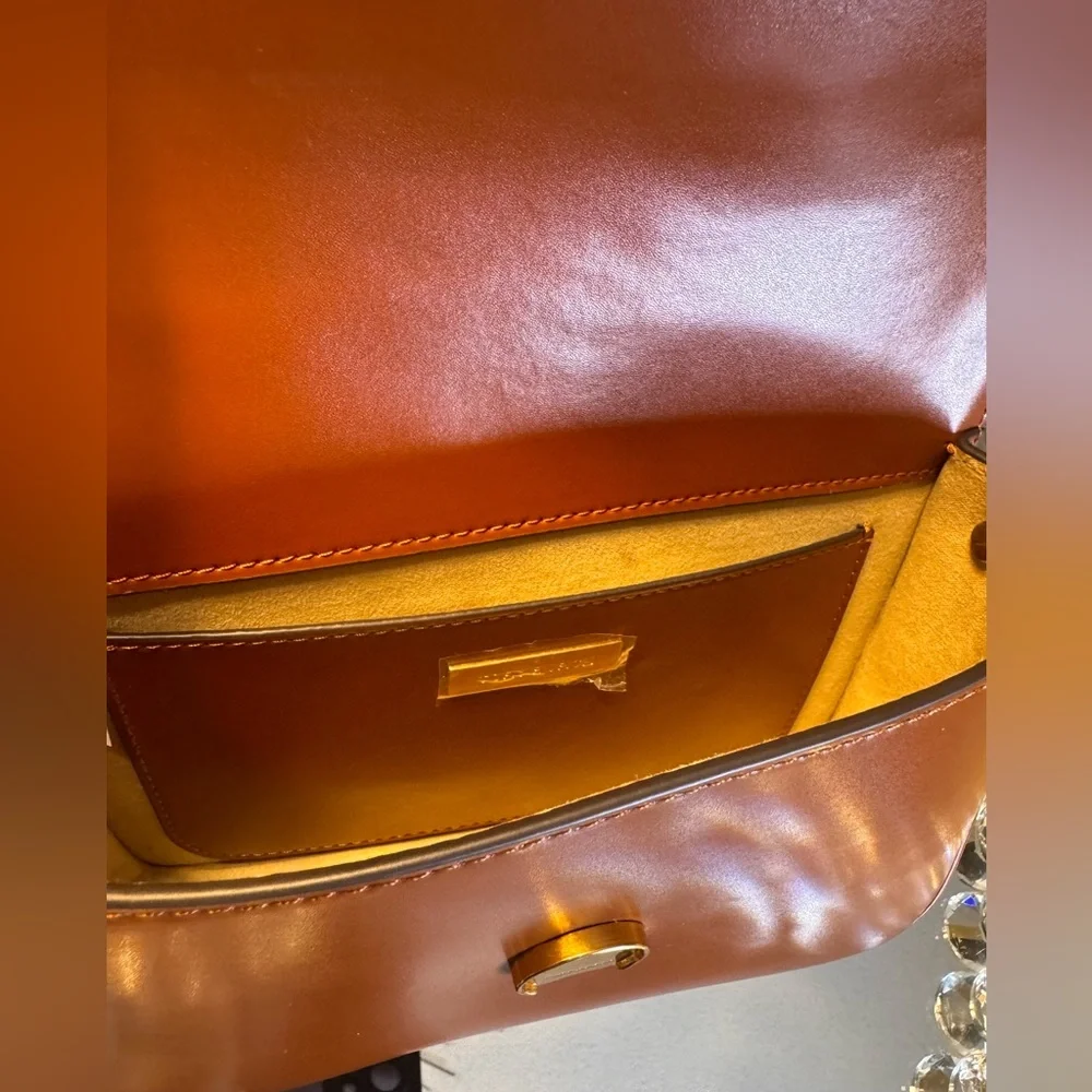 Tory Burch stitching clasp polished