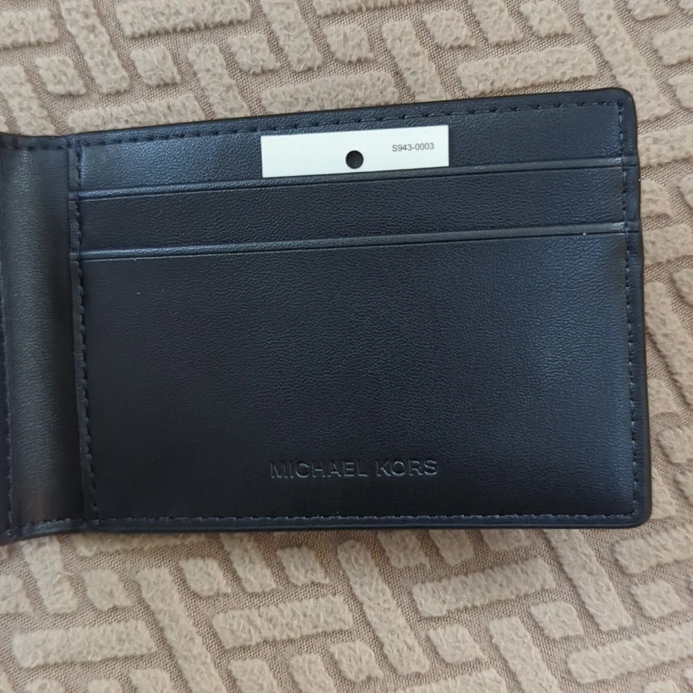 Michael Kors logo features stylish