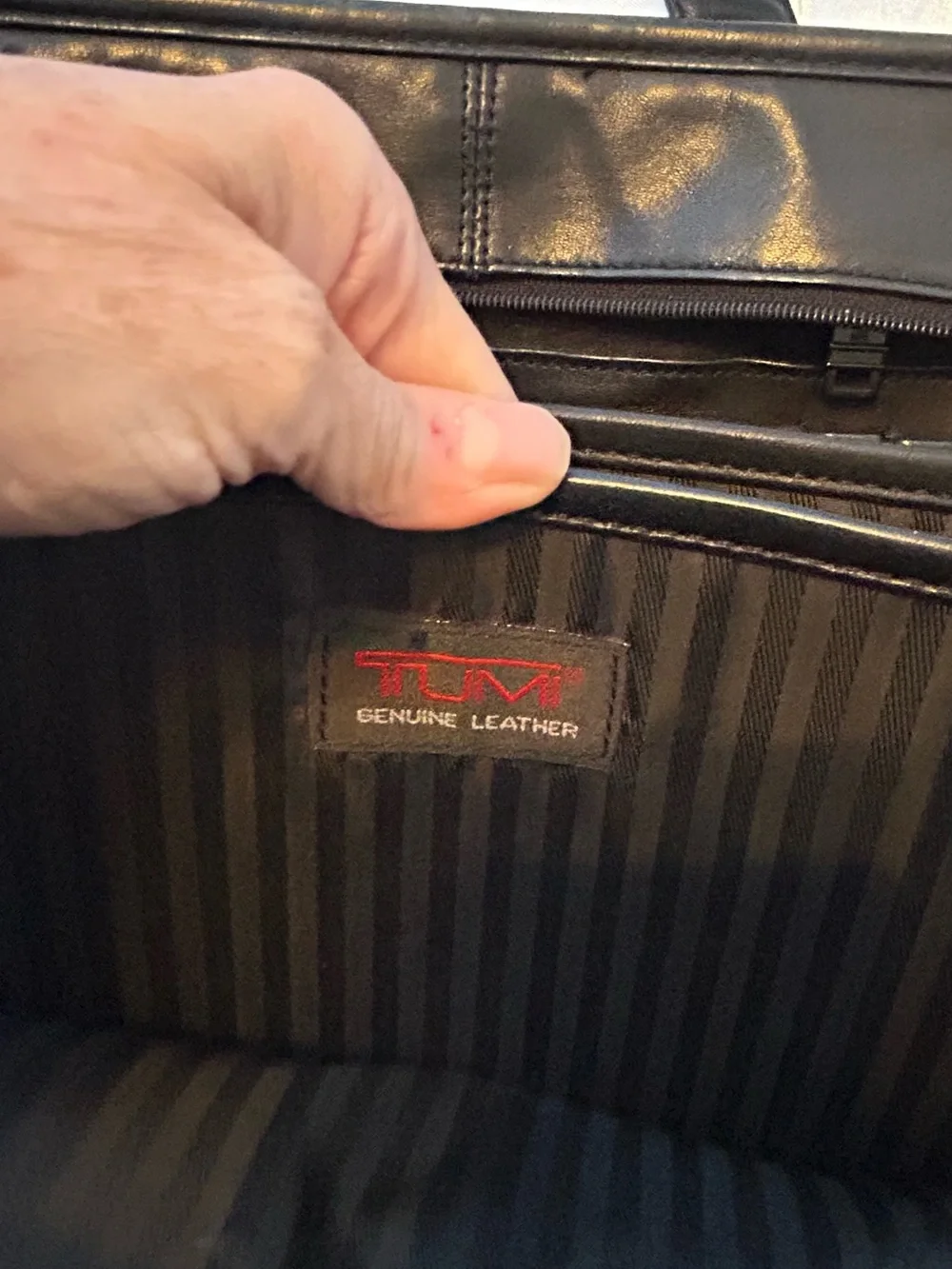 Tumi black leather