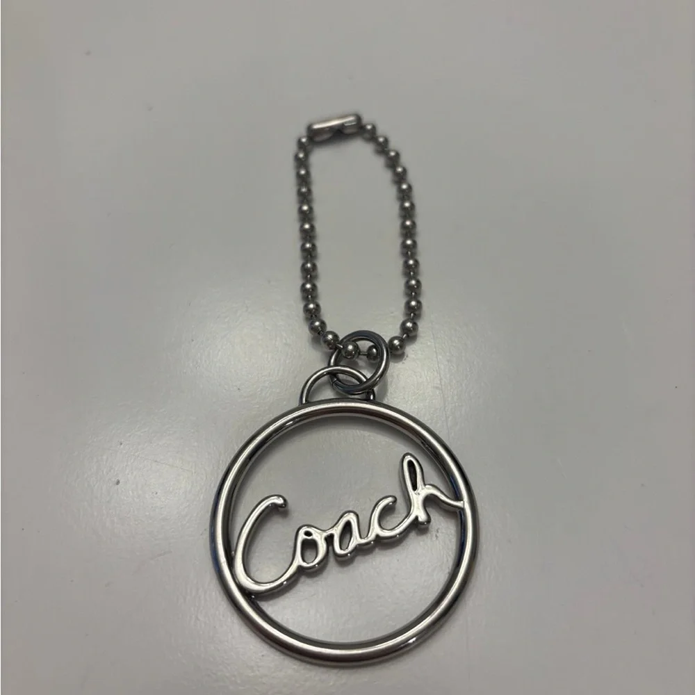 Coach round silver