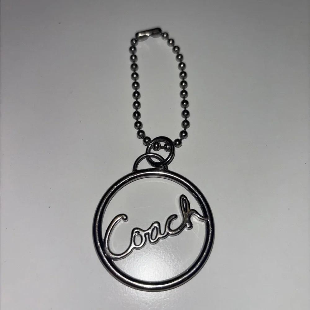 Coach round silver