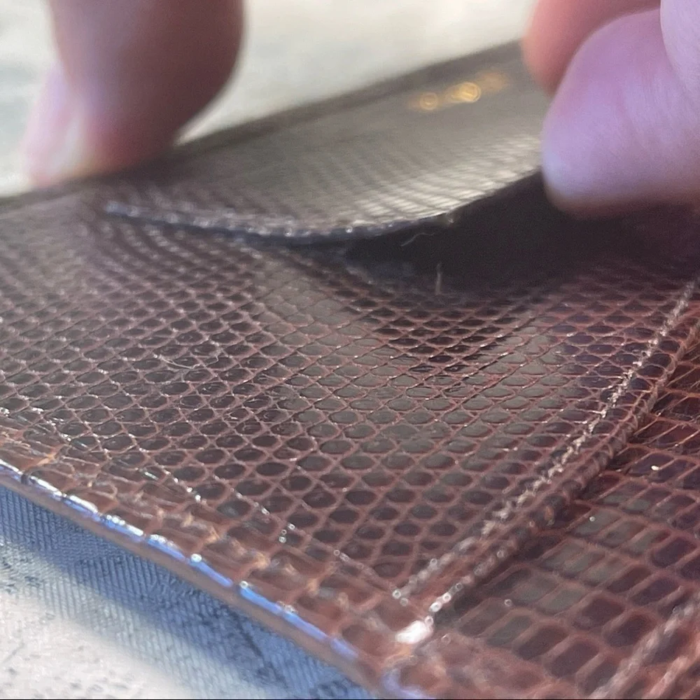 Smythson Antique lizard skin passport wallet with gold corners