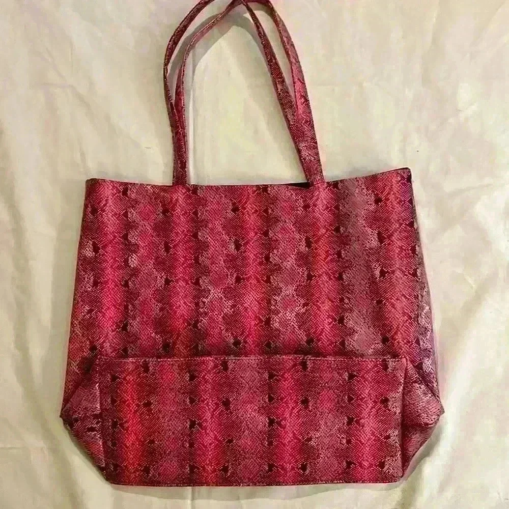 Saks Fifth Avenue tote bag, pink snakeskin, open, no closure, 10”handle,17”x 14”