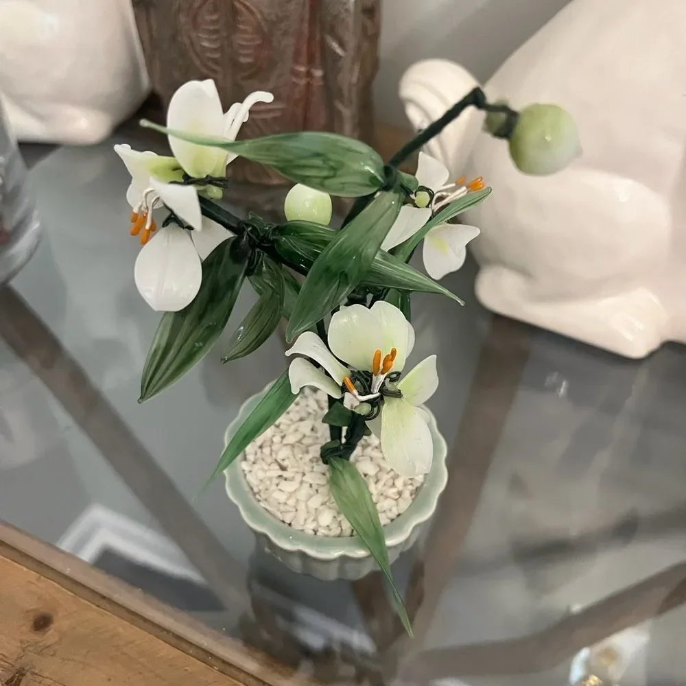 Vintage jade quartz tree in celadon pot. White and Green Plant.