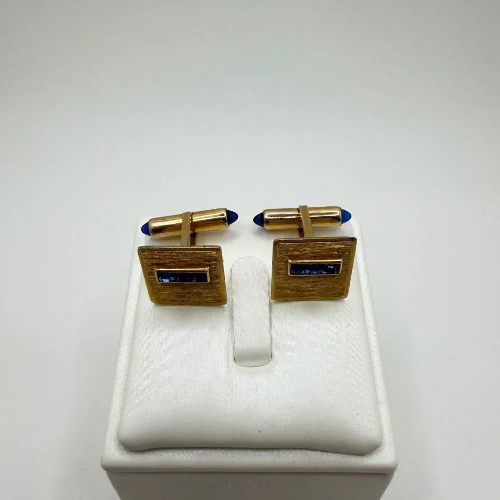 Vintage Krementz Gold tone cuff likes with princess cut blue rhinestone accents!