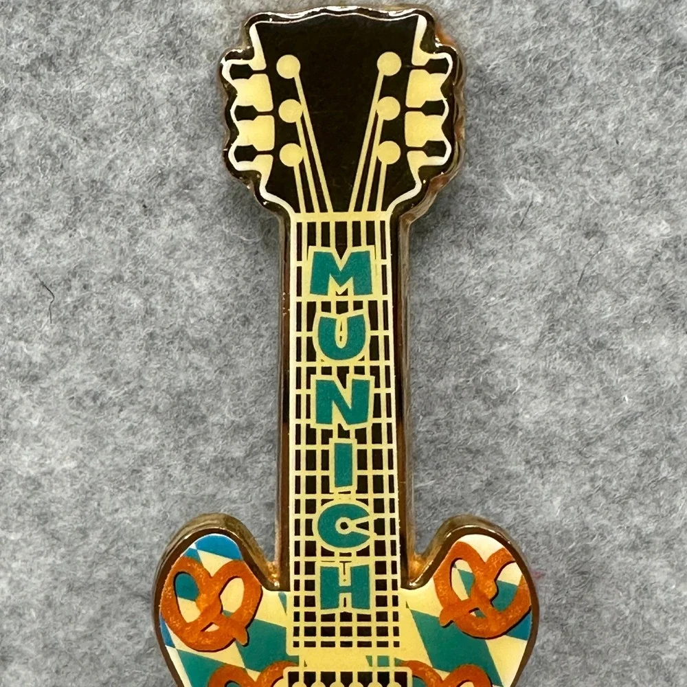 RARE Hard‎ Rock Cafe Munich Guitar Shaped Bottle Opener Pretzel Design