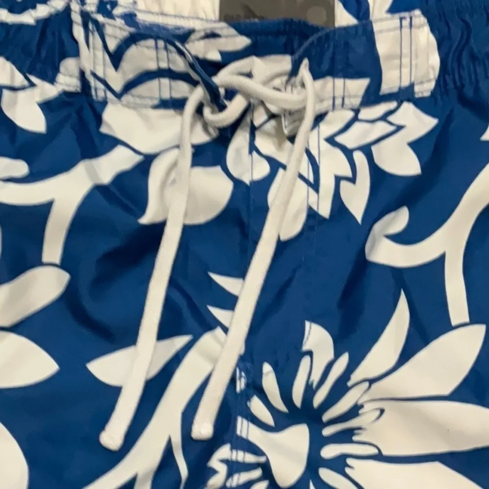Old Navy blue & white floral swimming trunks. Size XL (40-42)