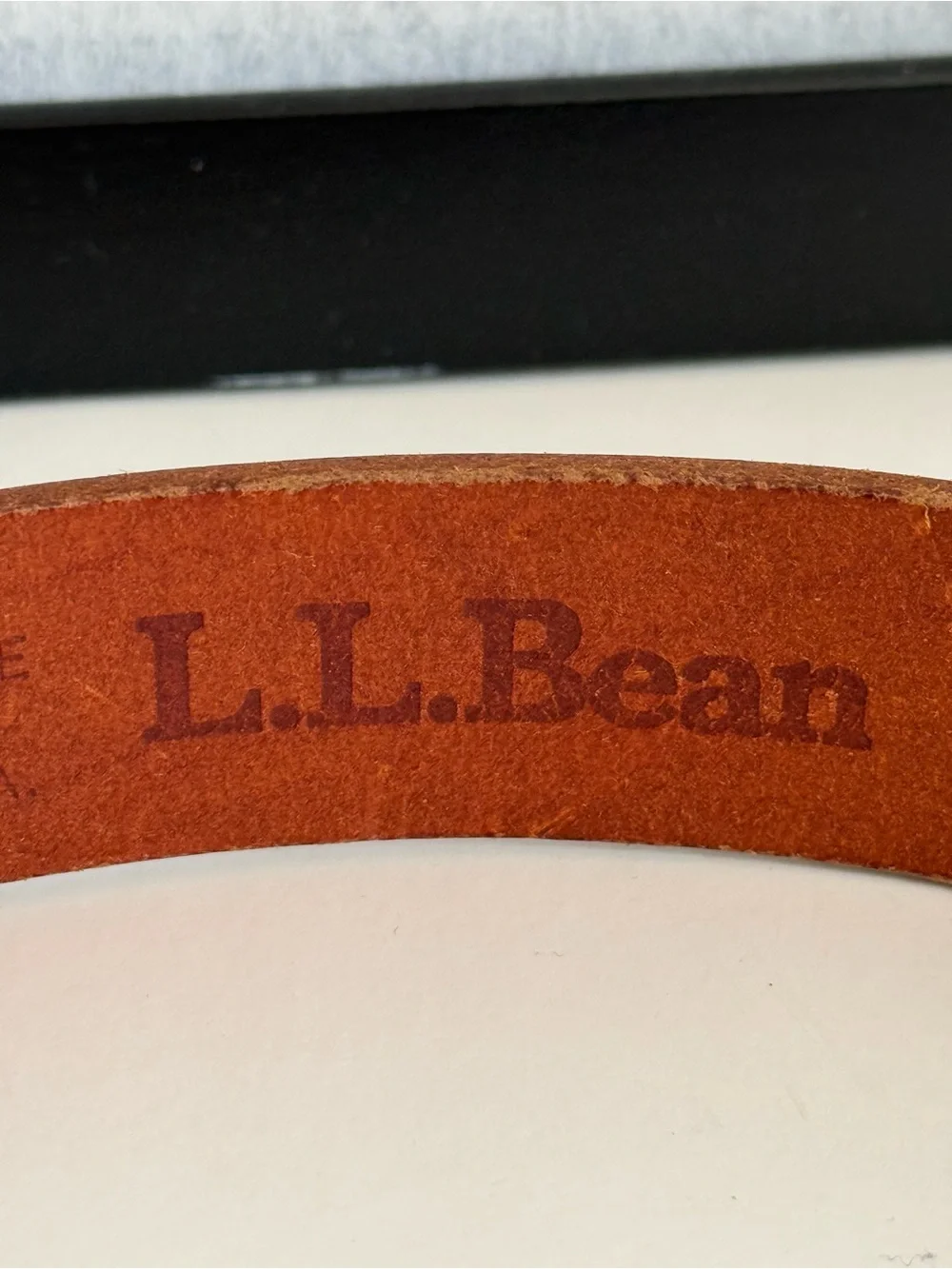 L.L. Bean brass genuine around