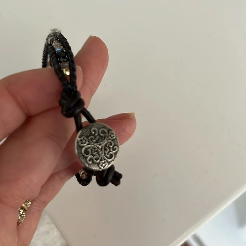 Black beaded rope bracelet with Celtic emblem