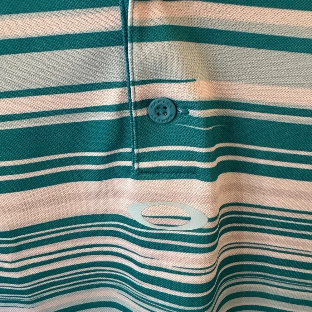 Oakley rips stains* polo