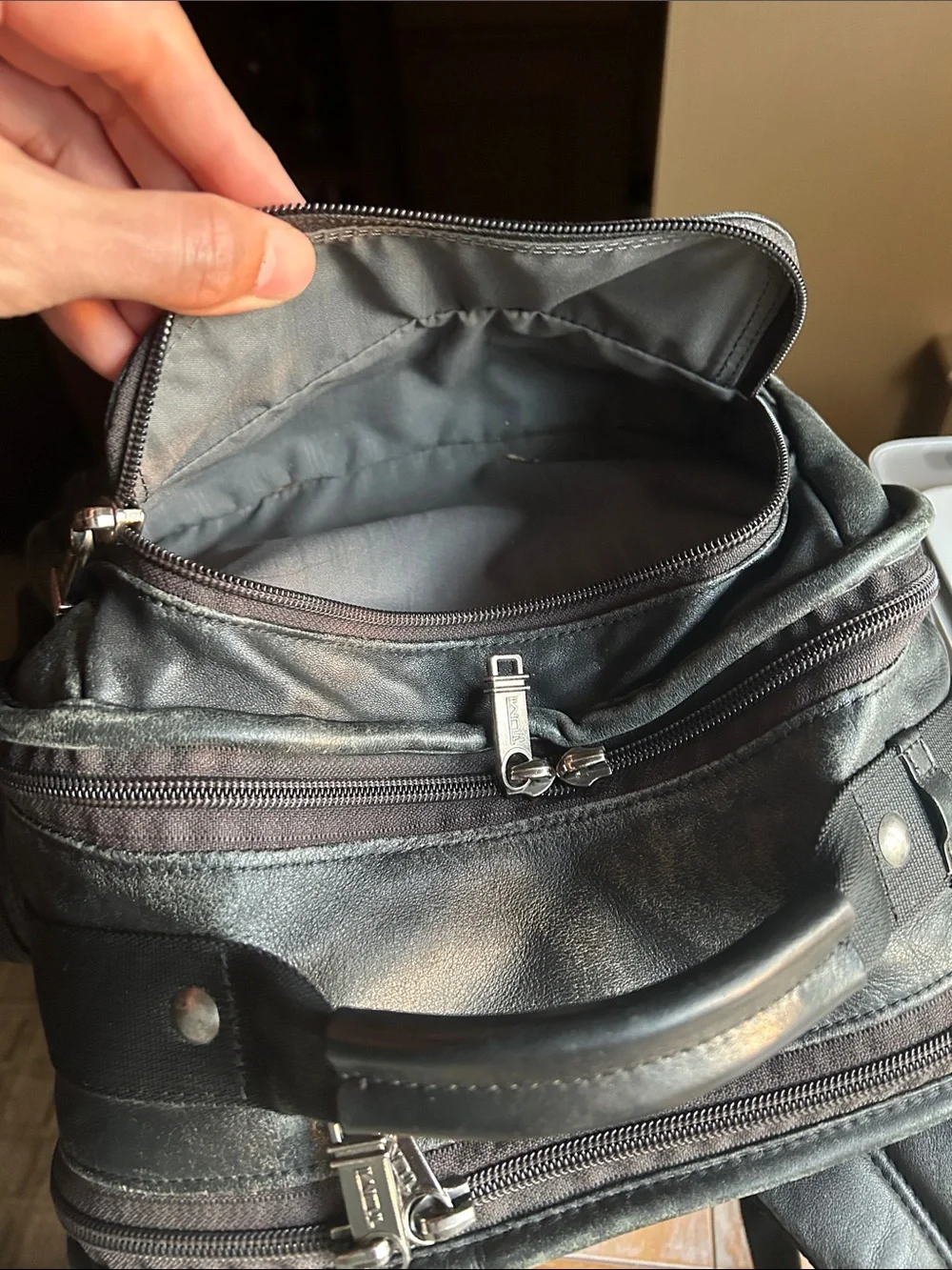 Tumi Black Leather Multi-Compartment Backpack
