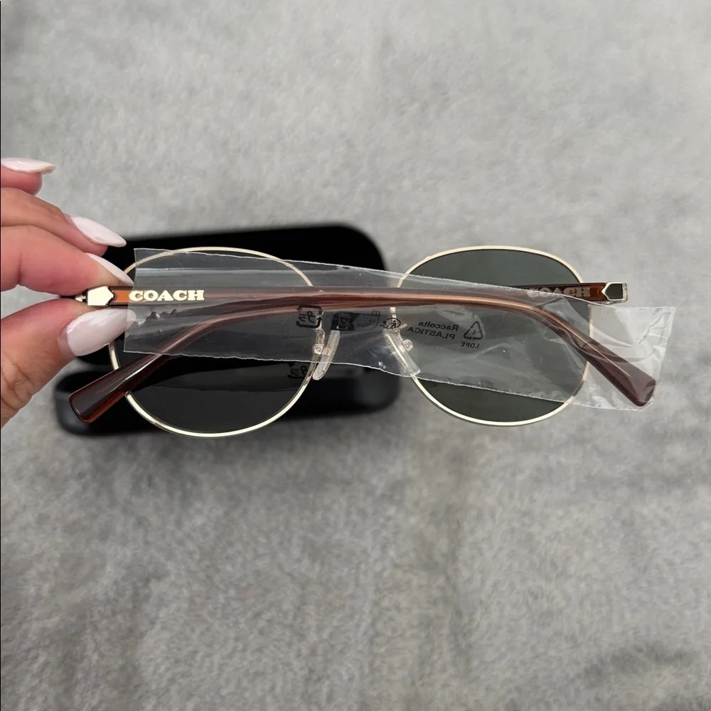 Coach gold lens