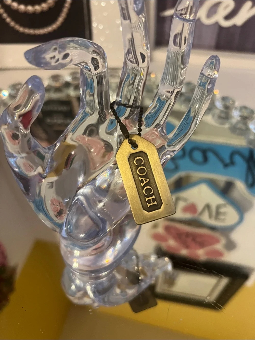 Coach color brass  metal tag
