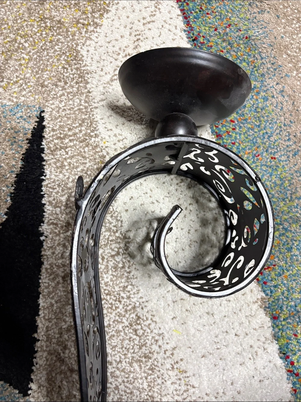 One Pier One Black Metal Scroll Wall Sconce.