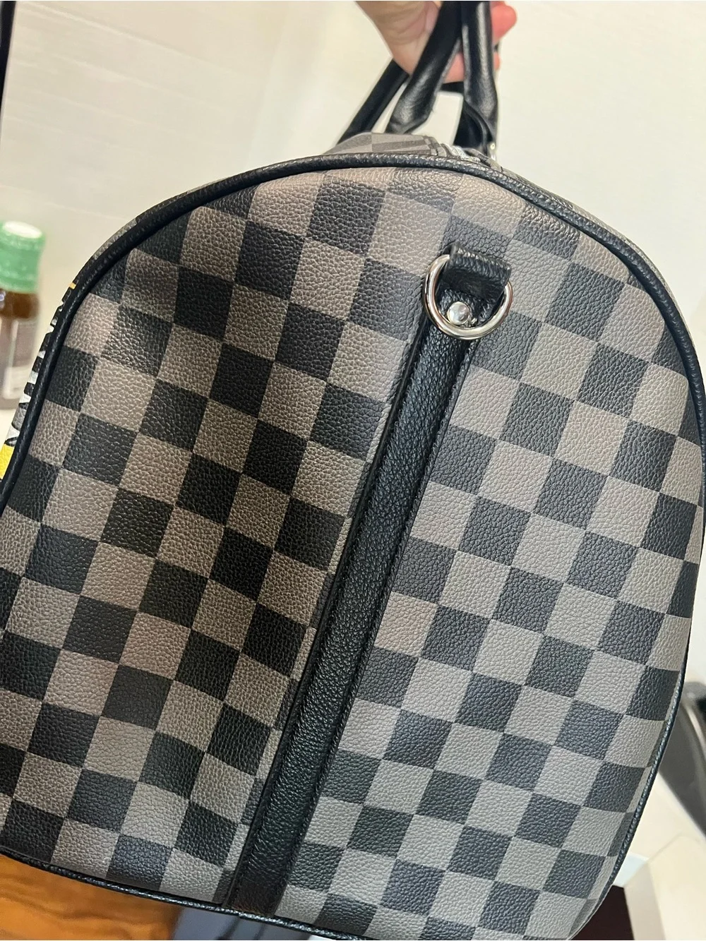 Ed Hardy duffel bag features a black and grey checkered pattern