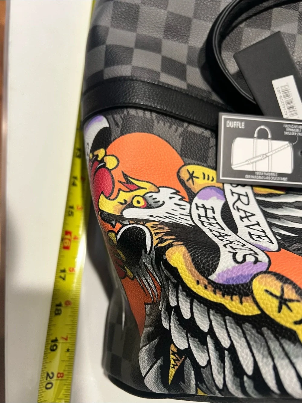 Ed Hardy duffel bag features a black and grey checkered pattern