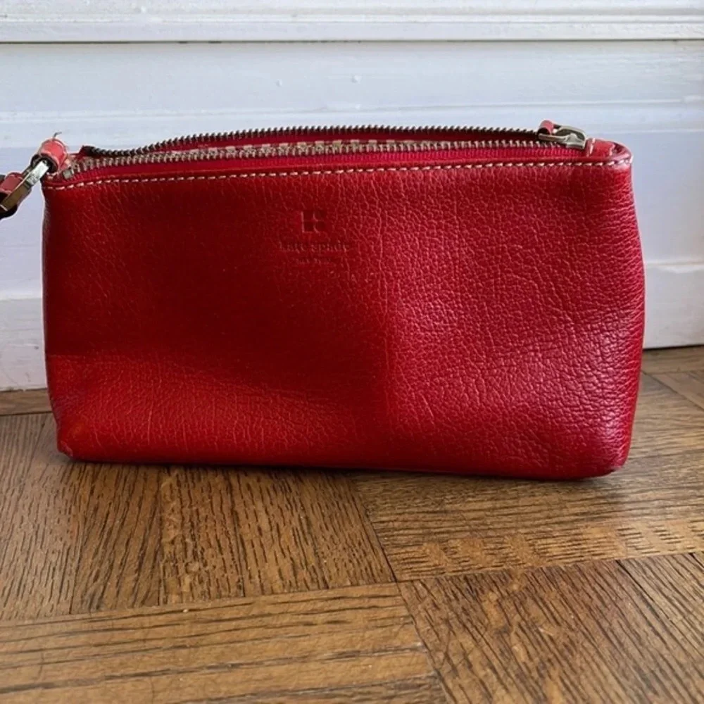 Kate Spade red pebbled leather wristlet bag
