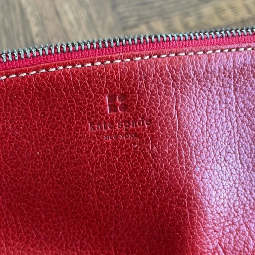 Kate Spade red pebbled leather wristlet bag