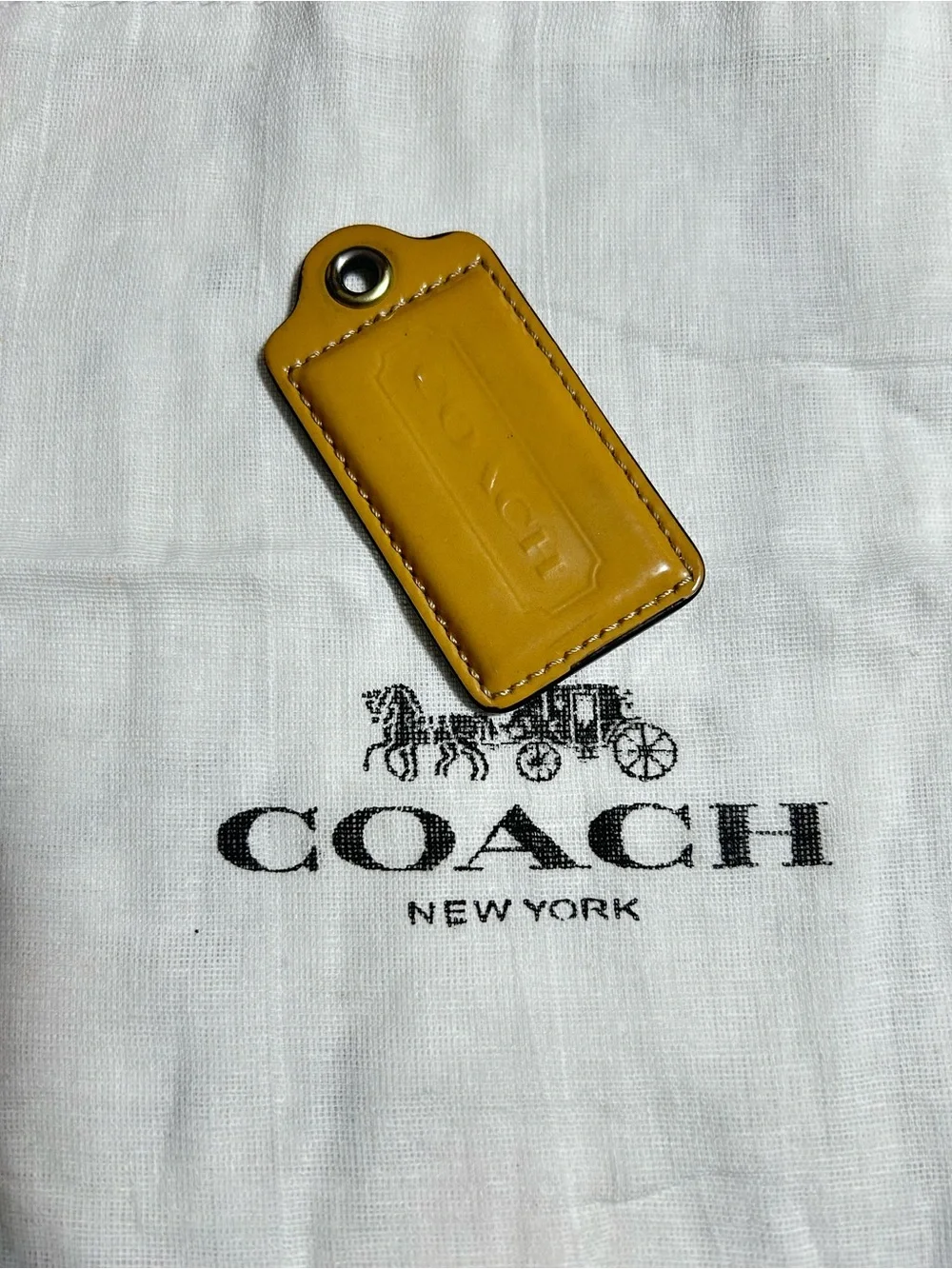 Coach Mustard Leather hang tag
