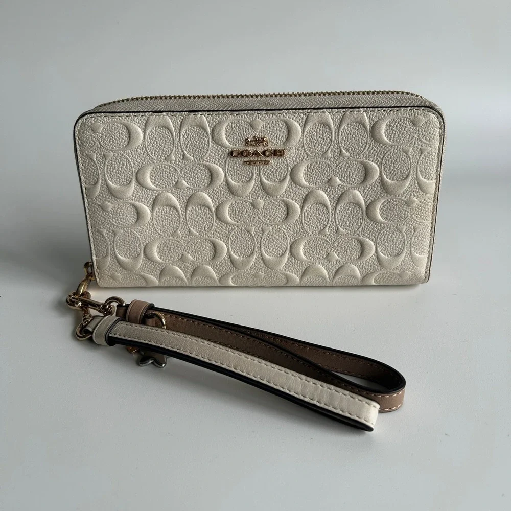 Coach Signature Embossed Chalk White Pebbled Leather Wristlet Excellent