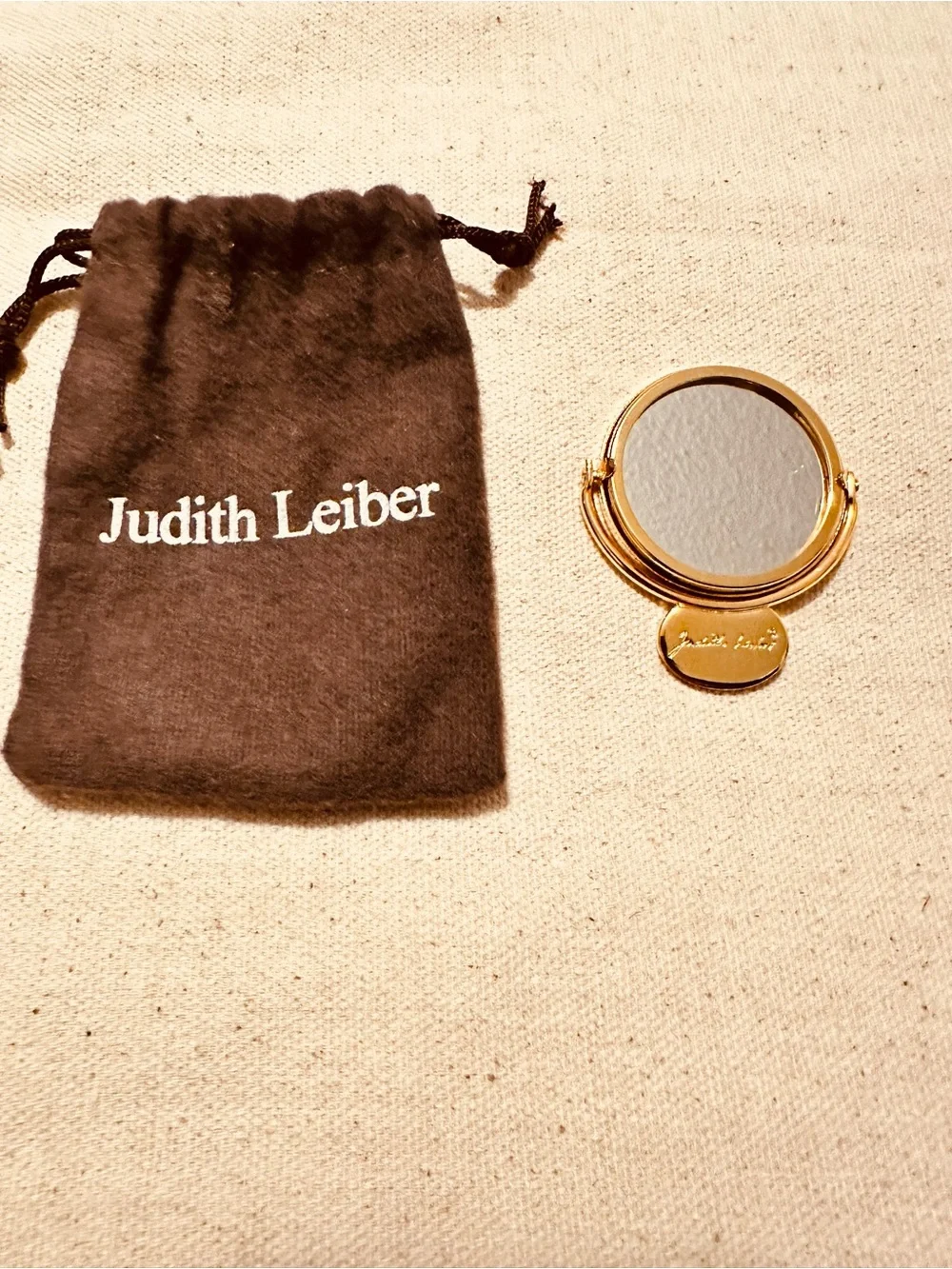 Judith Leiber gold mirror compact