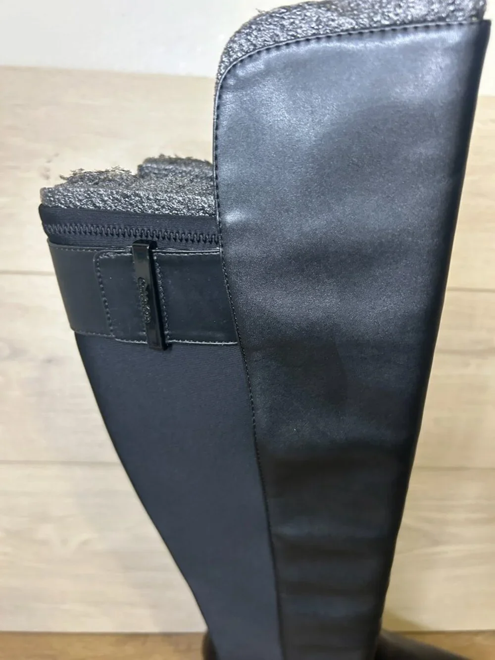 Calvin Klein over boots