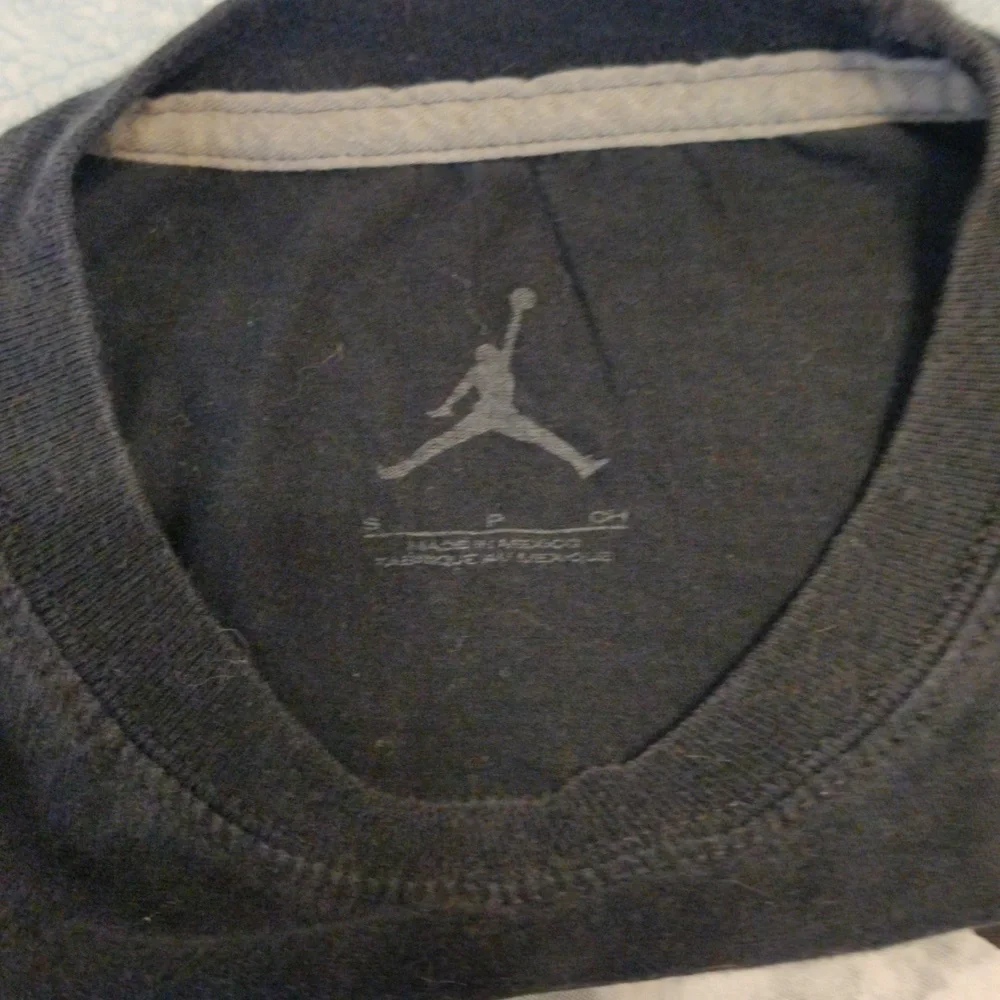 Jordan shirt with Chicago displayed in the middle