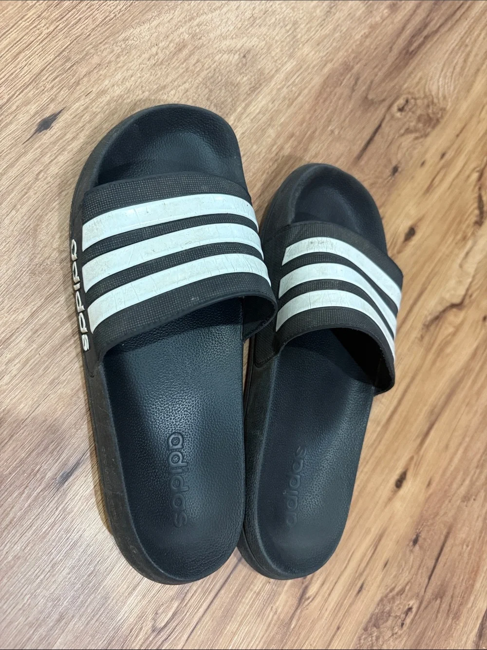 Men’s size 11 adidas Black Slides with White Three-Stripes