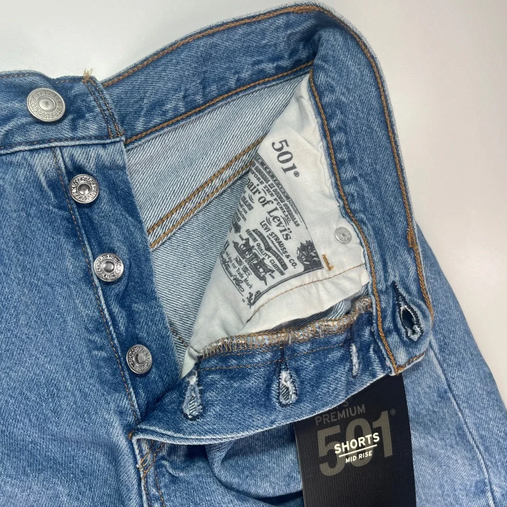 Levi's Premium 501 Long Shorts Women's 26 NWT Blue‎ Distressed Raw Hem Mid Rise