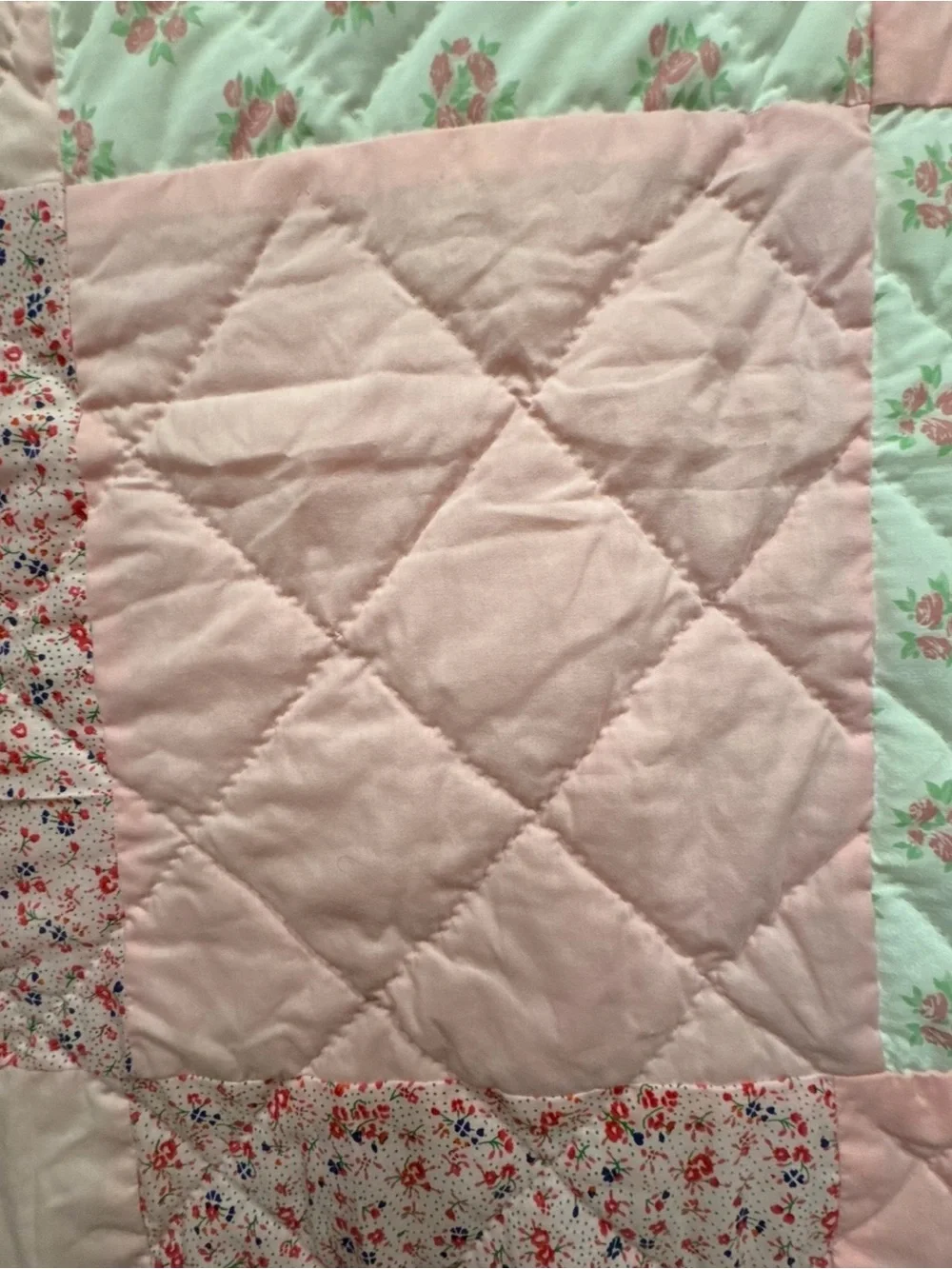 Handmade Pink Patchwork Quilt for your babies crib or toddler bed.